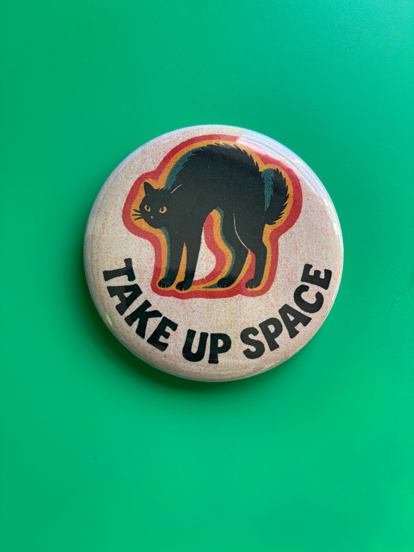 TAKE UP SPACE pinback button, 3 inches risograph style illustration